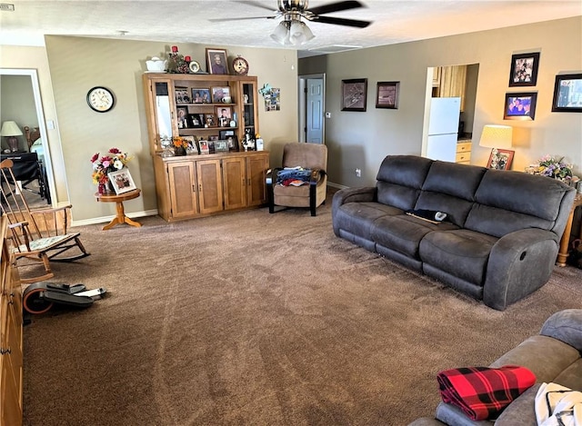 carpeted living room with ceiling fan