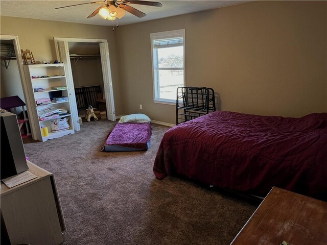 carpeted bedroom featuring a closet and ceiling fan