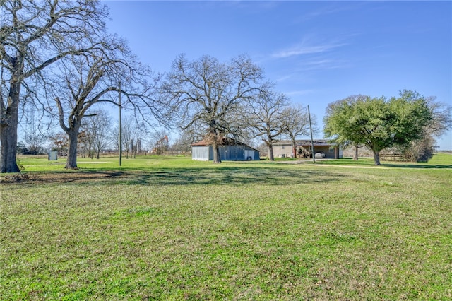 2095 Fm 1452 W, Madisonville, TX 77864 - view of green lawn with an outdoor structure