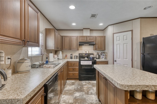 2095 Fm 1452 W, Madisonville, TX 77864 - kitchen featuring black appliances, under cabinet range hood, a sink, light countertops, and recessed lighting