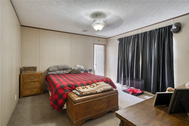 2095 Fm 1452 W, Madisonville, TX 77864 - carpeted bedroom featuring a ceiling fan and a textured ceiling