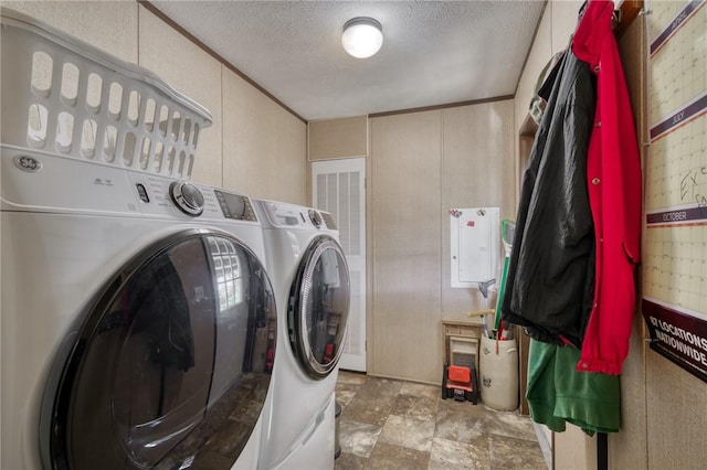 2095 Fm 1452 W, Madisonville, TX 77864 - laundry room with separate washer and dryer, a textured ceiling, and stone finish flooring