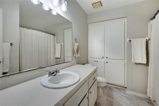 1900 Dartmouth St Unit F6, College Station, TX 77840 - bathroom featuring toilet, visible vents, marble finish floor, and vanity