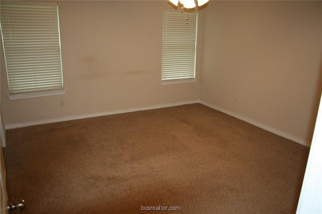 empty room with baseboards and carpet floors