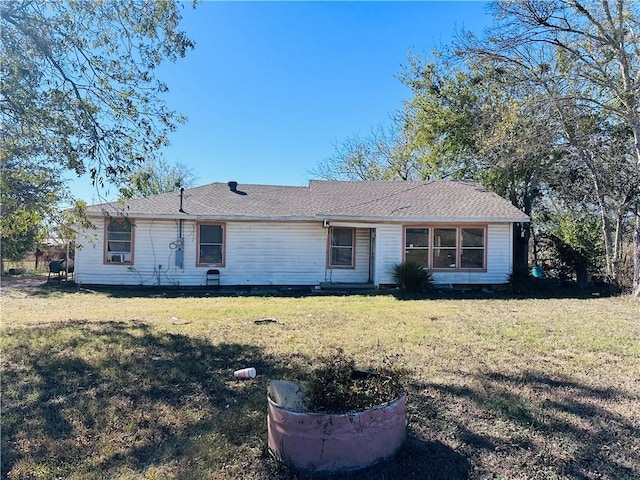 ranch-style house with a front lawn