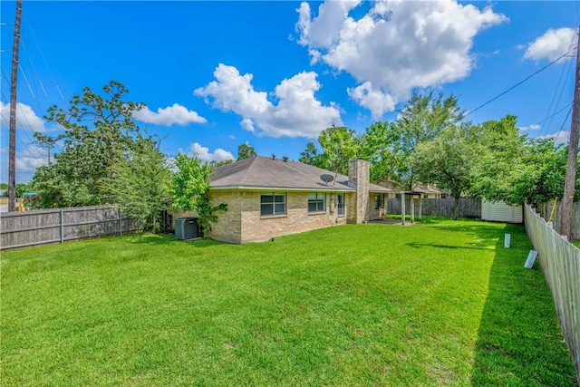 1011 Val Verde Dr, College Station, TX 77845 - rear view of property featuring a fenced backyard and a chimney