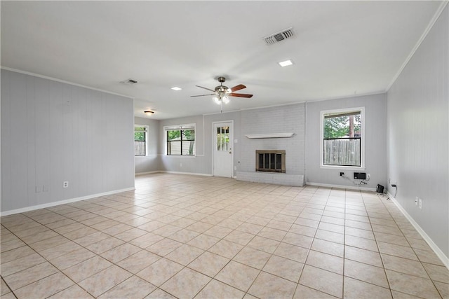 1011 Val Verde Dr, College Station, TX 77845 - unfurnished living room featuring crown molding, a ceiling fan, plenty of natural light, and light tile patterned floors