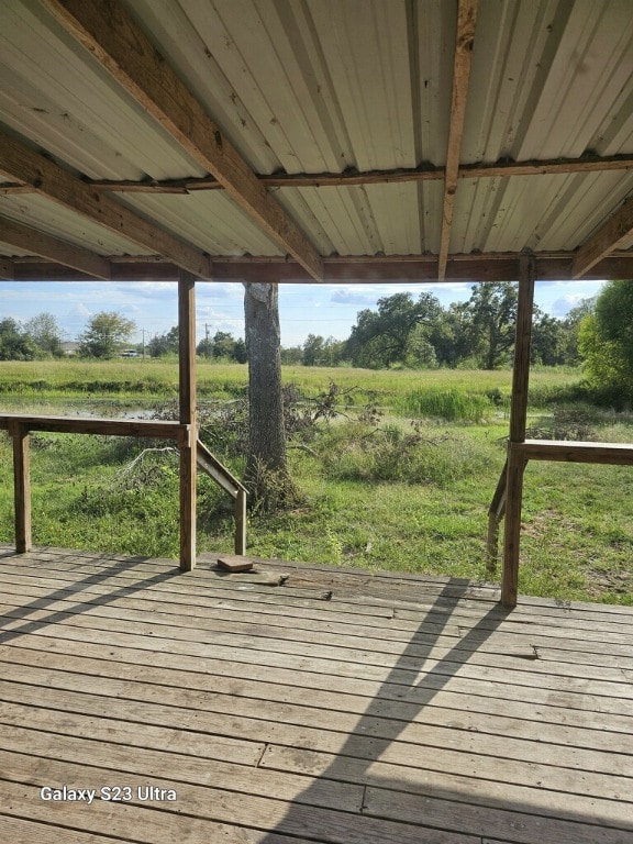 wooden deck with a rural view