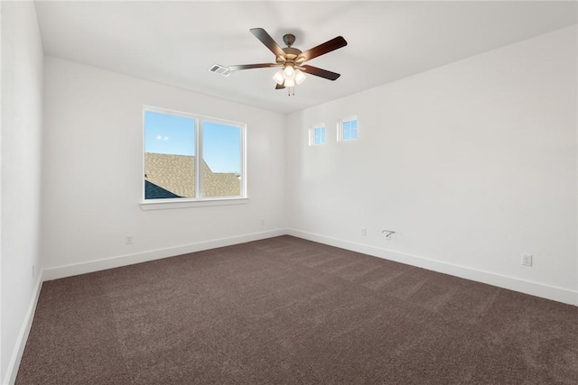 carpeted empty room featuring ceiling fan