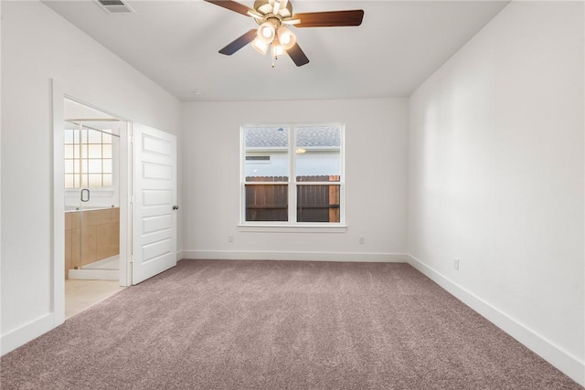 unfurnished bedroom with ceiling fan, light colored carpet, and multiple windows