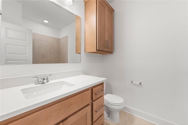 bathroom with tile patterned floors, vanity, and toilet