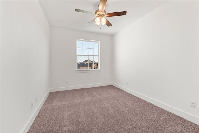 empty room featuring ceiling fan and carpet floors