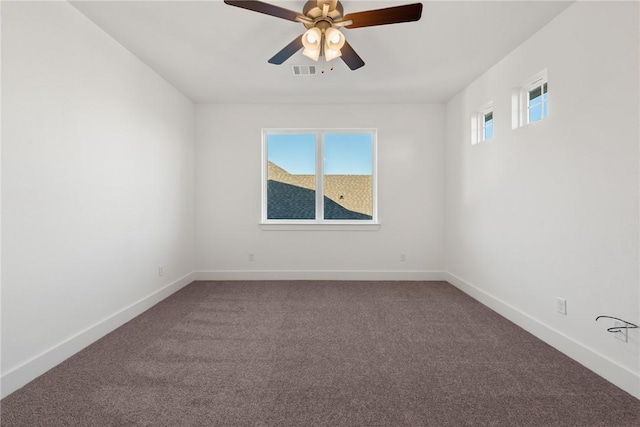 unfurnished room featuring ceiling fan, carpet floors, and a healthy amount of sunlight