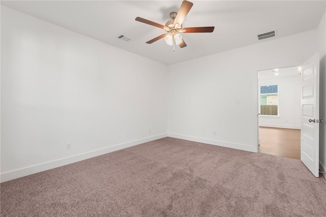 spare room with carpet flooring and ceiling fan