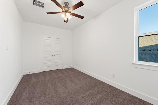 carpeted empty room with ceiling fan