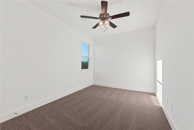 unfurnished room featuring ceiling fan and carpet