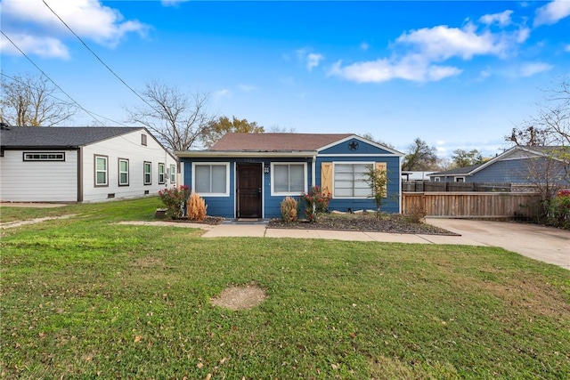 ranch-style home with a front lawn