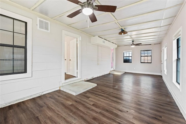 interior space featuring ceiling fan and dark hardwood / wood-style floors