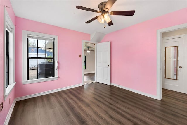 unfurnished bedroom with ceiling fan and dark hardwood / wood-style flooring