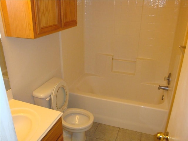 bathroom featuring tile patterned floors, vanity, toilet, and bathing tub / shower combination