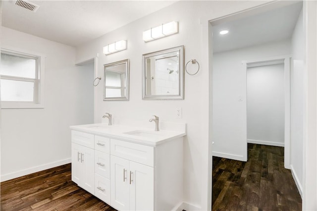 bathroom featuring vanity and wood-type flooring