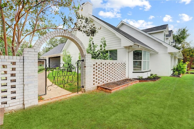 view of property exterior with a yard