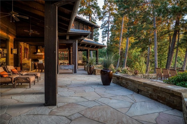 view of patio / terrace with ceiling fan and an outdoor living space