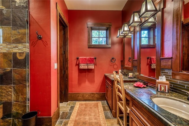 bathroom featuring decorative backsplash and vanity