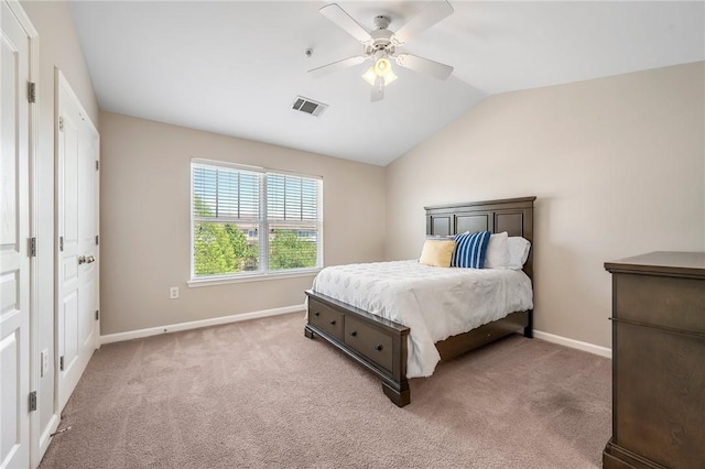 bedroom with carpet, baseboards, visible vents, a ceiling fan, and lofted ceiling
