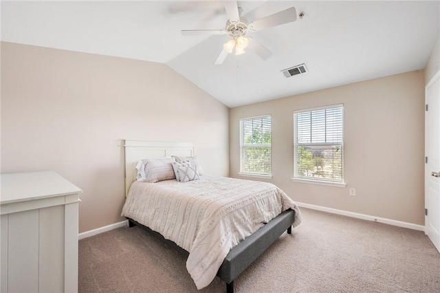 carpeted bedroom featuring visible vents, ceiling fan, vaulted ceiling, and baseboards