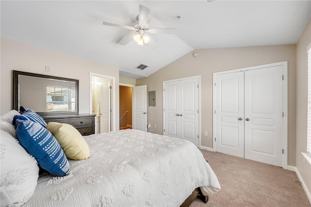 carpeted bedroom with ceiling fan, multiple closets, visible vents, baseboards, and lofted ceiling