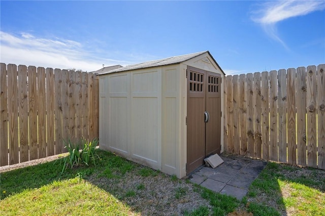 view of shed with a fenced backyard