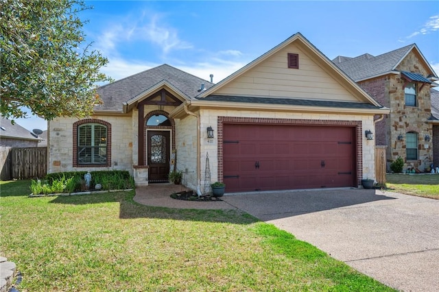 view of front facade with an attached garage, concrete driveway, a front yard, and a shingled roof