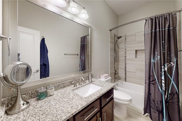 full bath with toilet, vanity, and shower / tub combo