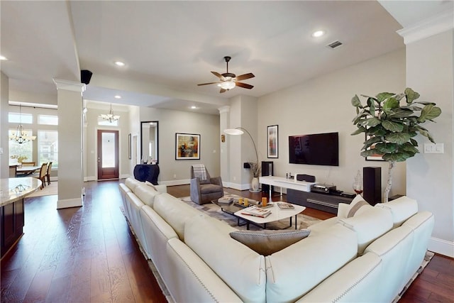 living area with a chandelier, dark wood-style flooring, baseboards, recessed lighting, and ornate columns