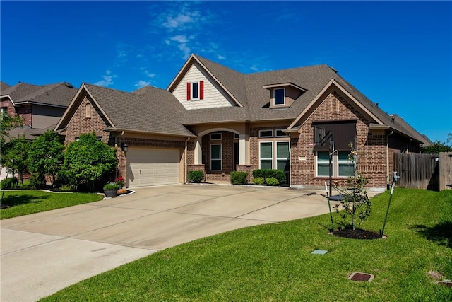craftsman-style home with brick siding, a garage, driveway, and roof with shingles