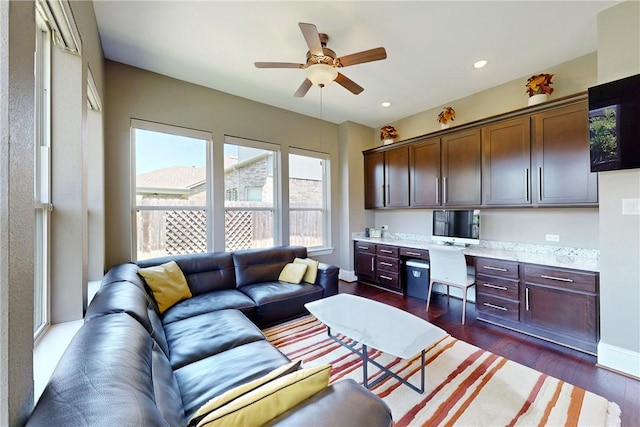 living area with ceiling fan, dark wood finished floors, and recessed lighting