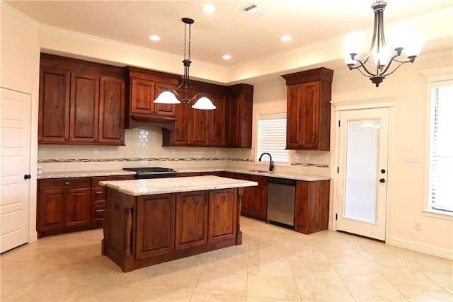 2123 Chestnut Oak Cir, College Station, TX 77845 - kitchen featuring appliances with stainless steel finishes, a chandelier, decorative backsplash, a center island, and crown molding