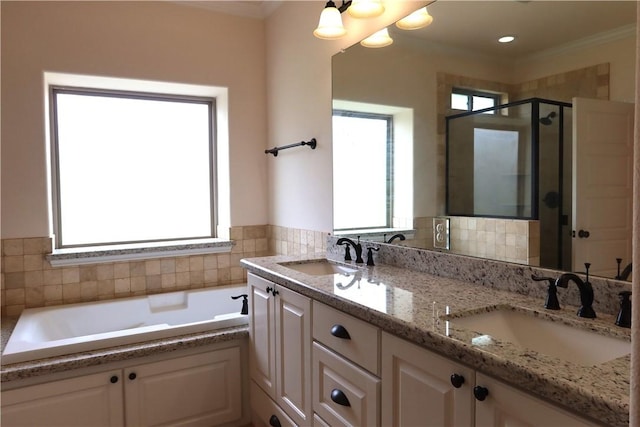 2123 Chestnut Oak Cir, College Station, TX 77845 - bathroom featuring a shower stall, double vanity, a garden tub, and ornamental molding