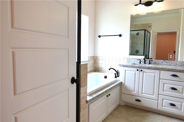 2123 Chestnut Oak Cir, College Station, TX 77845 - full bath with a stall shower, vanity, a garden tub, and tile patterned floors