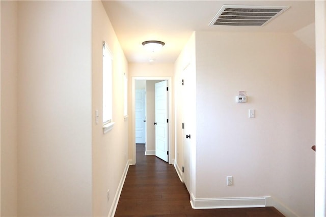 2123 Chestnut Oak Cir, College Station, TX 77845 - corridor with dark wood finished floors and baseboards