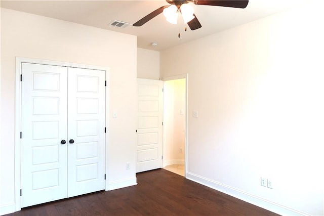 2123 Chestnut Oak Cir, College Station, TX 77845 - unfurnished bedroom featuring baseboards, a closet, dark wood-style floors, and a ceiling fan