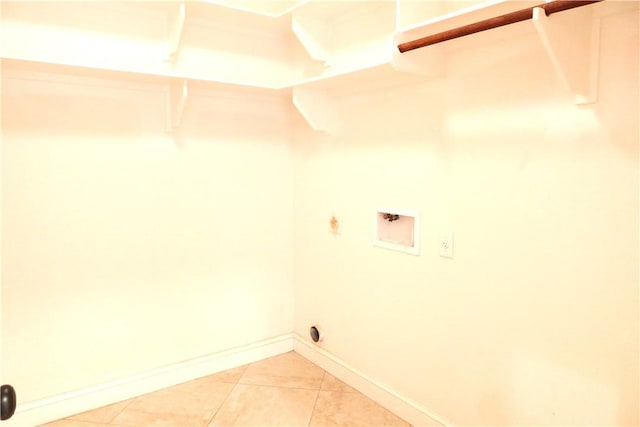 2123 Chestnut Oak Cir, College Station, TX 77845 - laundry room with hookup for a washing machine, baseboards, light tile patterned floors, and hookup for a gas dryer