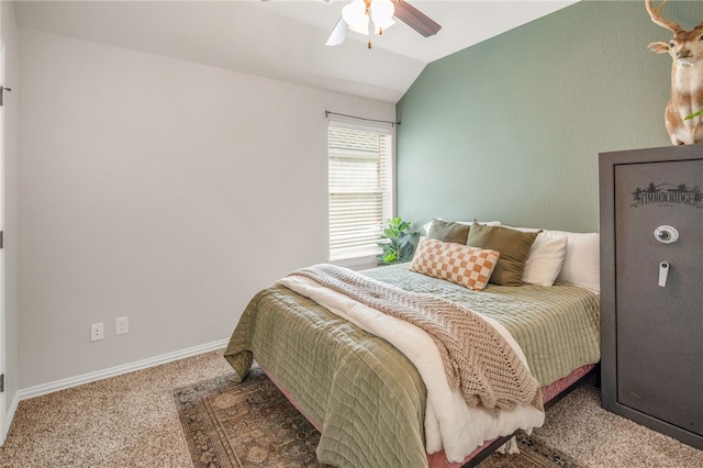 bedroom with lofted ceiling, ceiling fan, carpet flooring, and baseboards