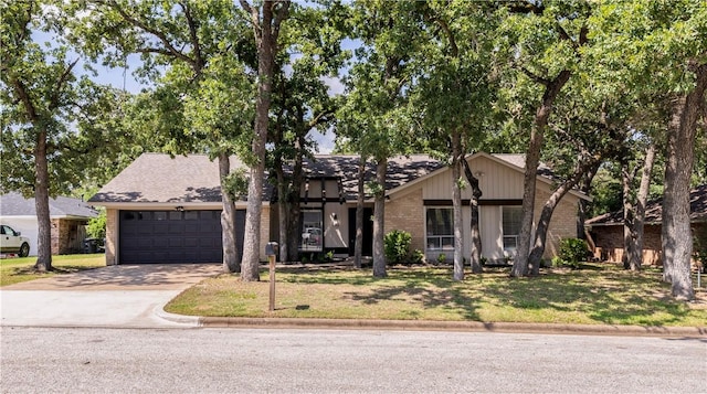 2008 Rayburn Ct, College Station, TX 77840 - mid-century inspired home with a garage, driveway, a front lawn, and brick siding