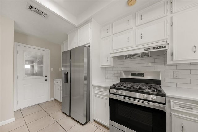2008 Rayburn Ct, College Station, TX 77840 - kitchen with appliances with stainless steel finishes, ventilation hood, light countertops, and white cabinets