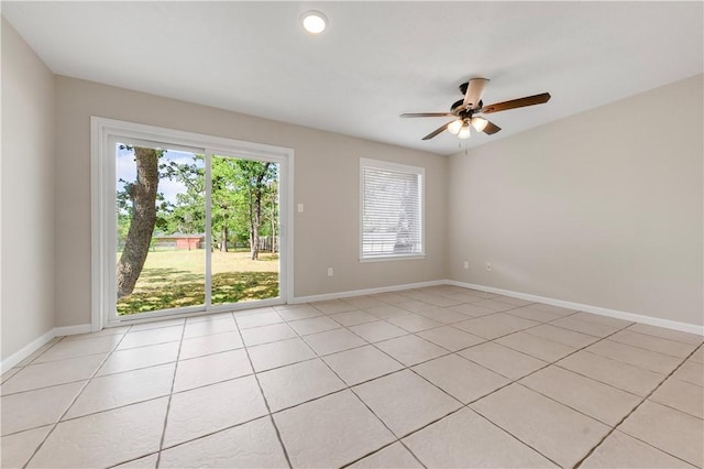 2008 Rayburn Ct, College Station, TX 77840 - empty room featuring ceiling fan, light tile patterned floors, and baseboards