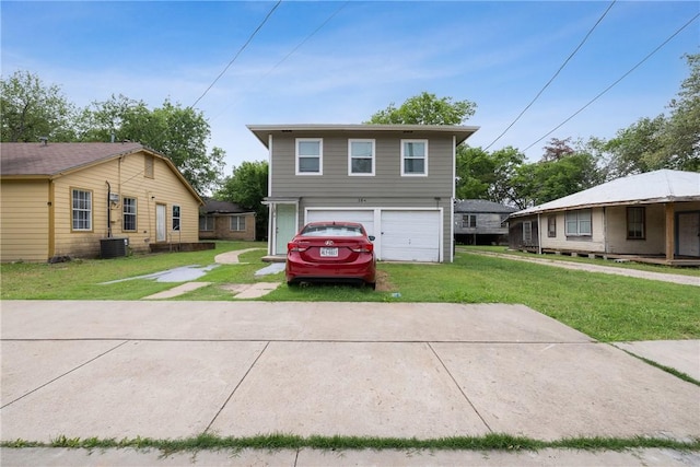 104 N Randolph Ave, Bryan, TX 77803 - view of front facade with driveway, a front lawn, a garage, and central air condition unit