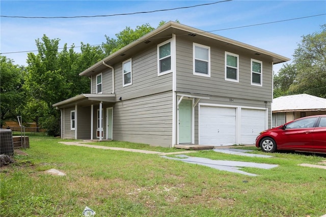 104 N Randolph Ave, Bryan, TX 77803 - view of front of property featuring a garage, a front yard, and cooling unit