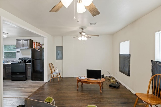 104 N Randolph Ave, Bryan, TX 77803 - dining space with ceiling fan, wood finished floors, and electric panel